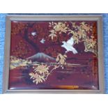 A fine early 20th century framed Japanese red-lacquer and gilt panel depicting Mount Fuji with