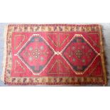 A Karabagh rug with red ground, Caucasus (cut) 173cm x 112cm