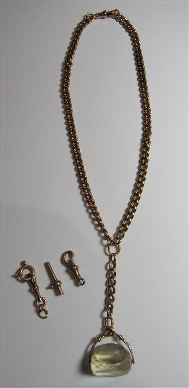 A rose gold watch chain that has been adapted into a necklace with a pendant drop faceted lemon