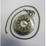 A silver half hunter pocket watch with an unmarked white metal Herringbone chain attached. Inner