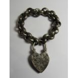 An unmarked silver (tested) large single heart clasp bracelet on a large link belcher chain that