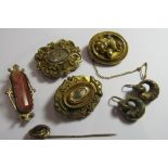 A collection of Victorian and Edwardian jewellery to include a gold faced garnet set stick pin, an