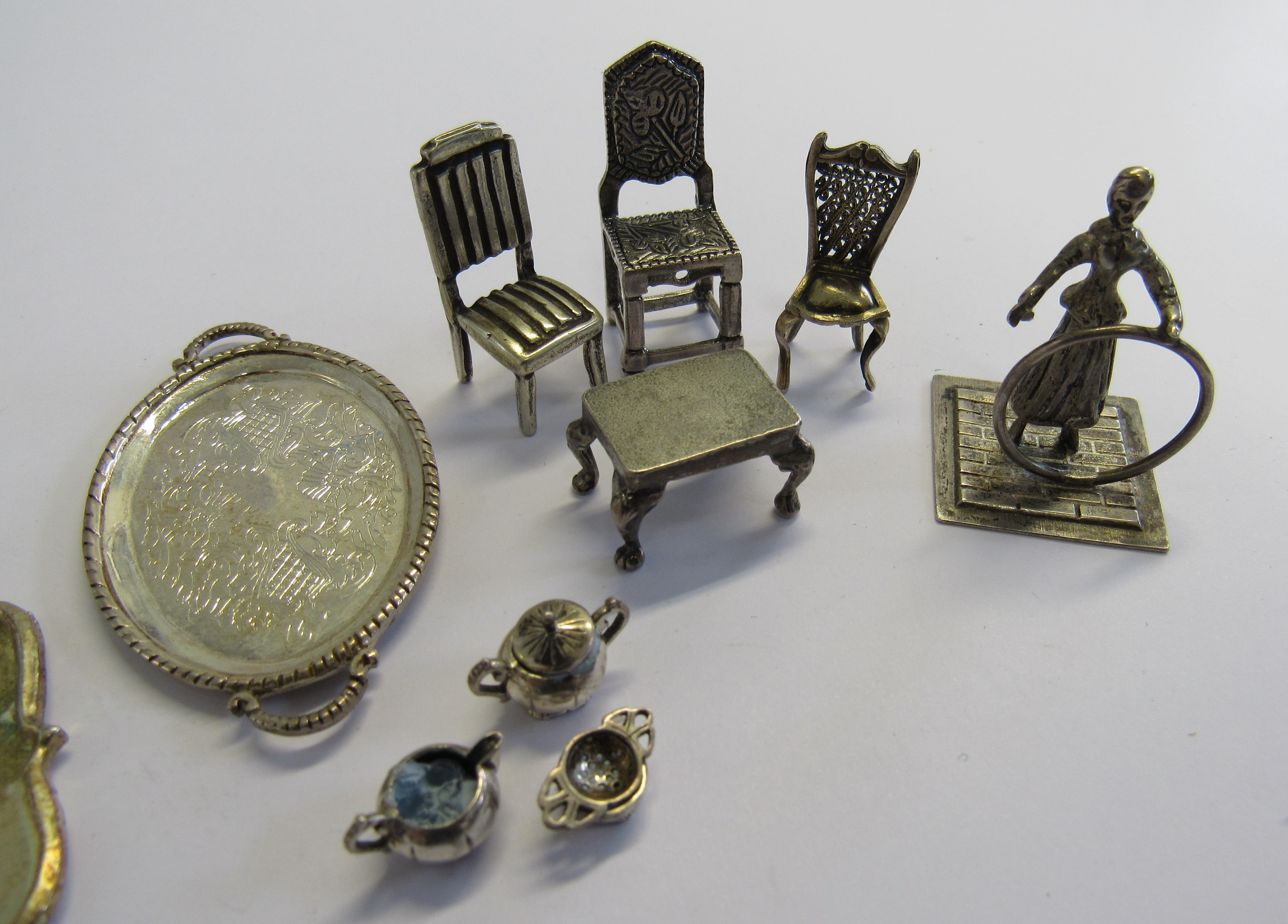 A collection of unmarked white metal micro miniature dolls house items comprising of three dining - Image 2 of 2