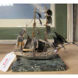 A mounted silver galleon on marble and stamped