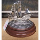 A wood mounted silver galleon The Golden Hind and stamped