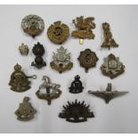 14 Army Cap Badges including Royal Corps Canadian Ordinance KGVI Crown, Plastic Royal Sussex Reg.