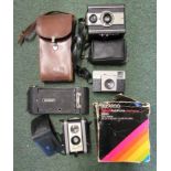 A collection of various old cameras.