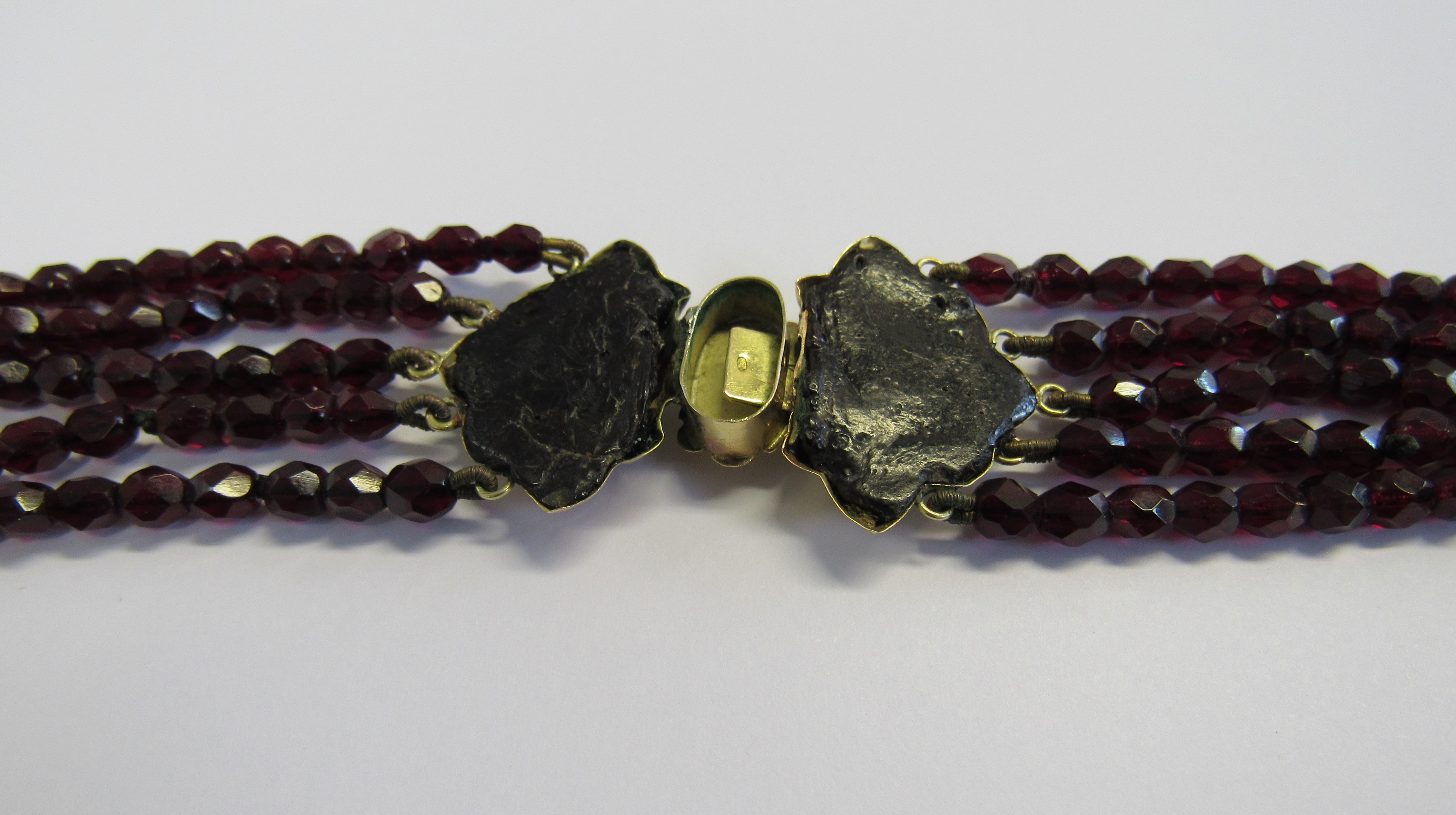 A Victorian Raj garnet choker necklace fitted with a marked 585 bi-coloured gold lotus shaped clasp. - Image 3 of 3