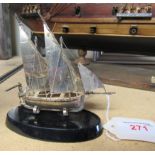 A mounted silver galleon and stamped