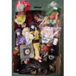 A collection of dolls dressed in costumes from various countries together with several pottery and