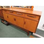 A G Plan four door teak sideboard with inner shelves to cupboards, two single drawers either side of