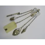 An Edwardian large silver Chatelaine with five suspended attachments. The clip hallmarked for