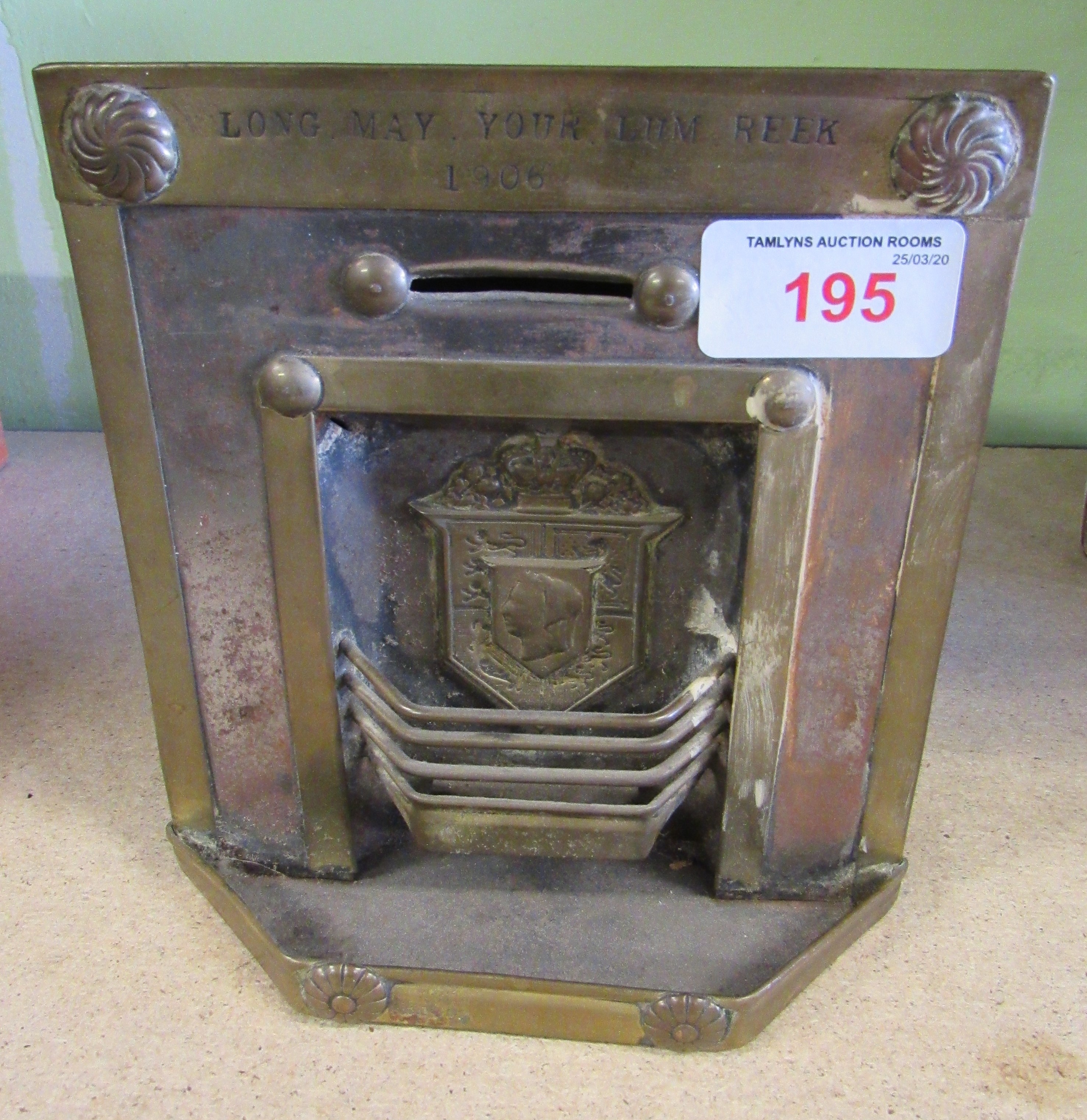 A tin plate money box of a fireplace 'LONG MAY YOUR LUM REEK 1906'