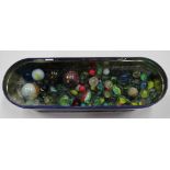 A tin of marbles, ages varied.