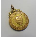A 9ct gold Stockport Harriers Club 1930 medal, adapted for pendant fob, inscribed to the back with