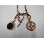 A marked 9ct rose gold watch chain with an attached 9ct rose gold Masonic open work pendant piece
