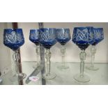 A set of 6 deep blue, cut glass, hock drinking glasses on tall stems. Beautifully etched and