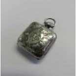 An Edwardian silver sovereign case of square form with an engraved pattern to front and back with