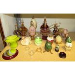 A quantity of coloured glass perfume bottles and Faberge type decorative eggs, together with Onyx