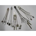 A collection of five metal, EPNS Chatelaines to include one with a nurses spatula plus a single