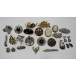 A collection of 22 vintage costume jewellery brooches to include two marked silver Scottish