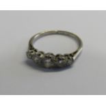 A platinum and old European cut diamond graduated five stone dress ring with the largest centrally