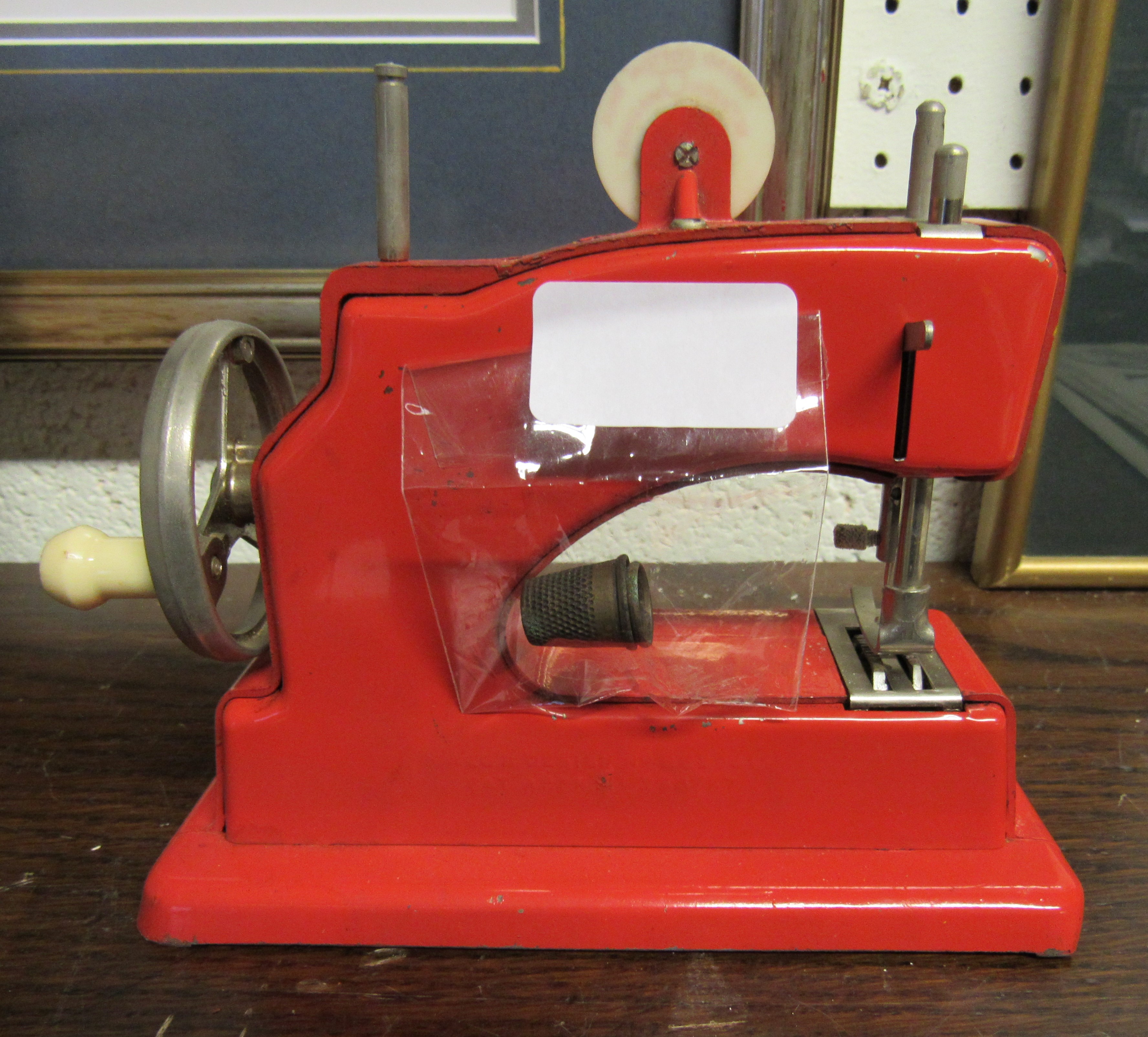 A children's tinplate Vulcan red sewing machine - Image 2 of 2