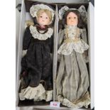 Two Wupper porcelain dolls in Victorian dress and boxed