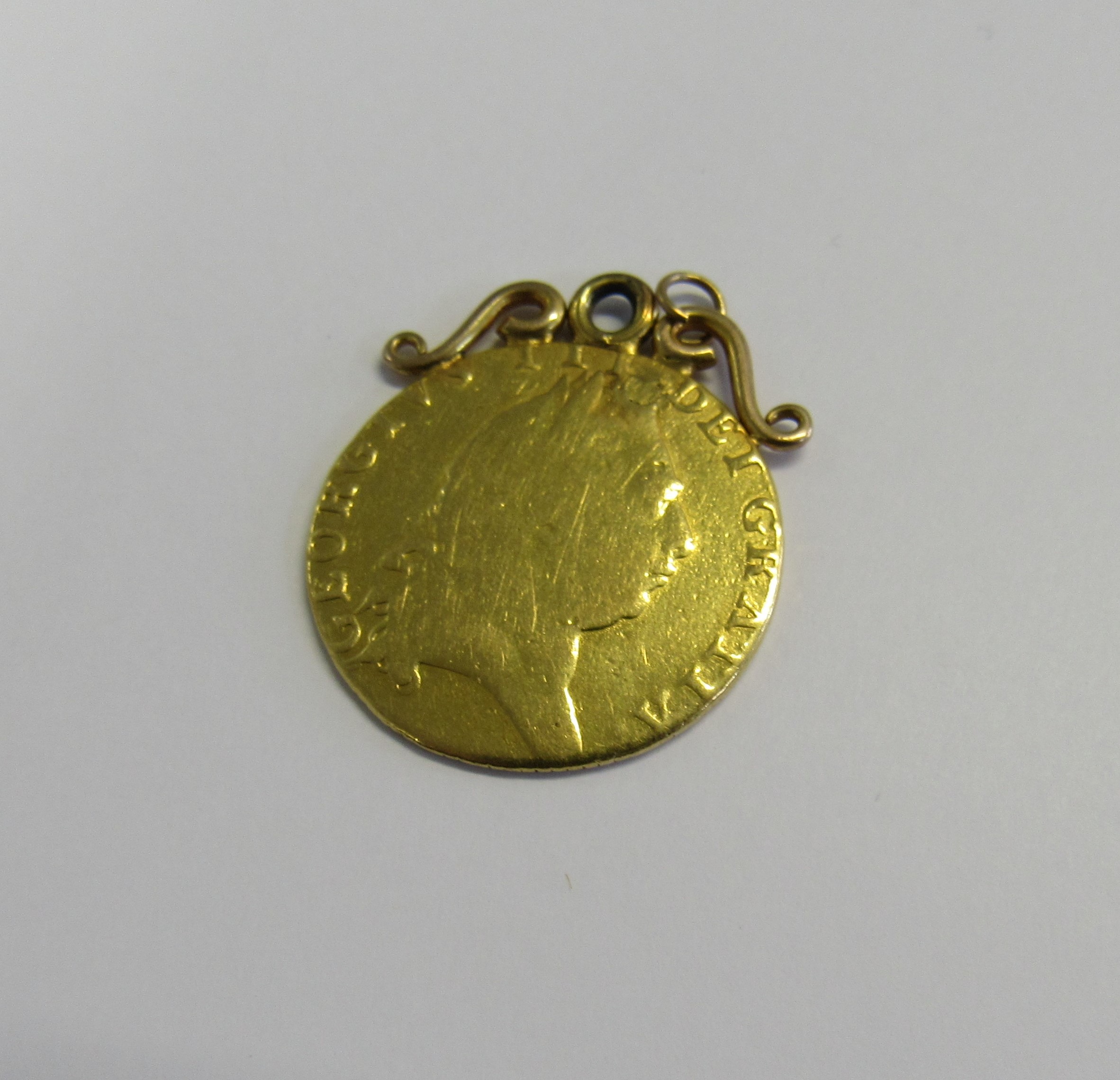 A George III 1793 gold spade Guinea, adapted for pendant/fob with an unmarked scroll top. Total - Image 2 of 2