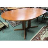 Teak drop leaf dining table of oval design