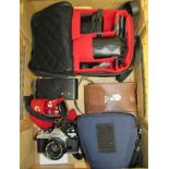 A Classic Canon SLR Camera AE1 with 50mm lens, a folding Kodak Brownie in case and a bag