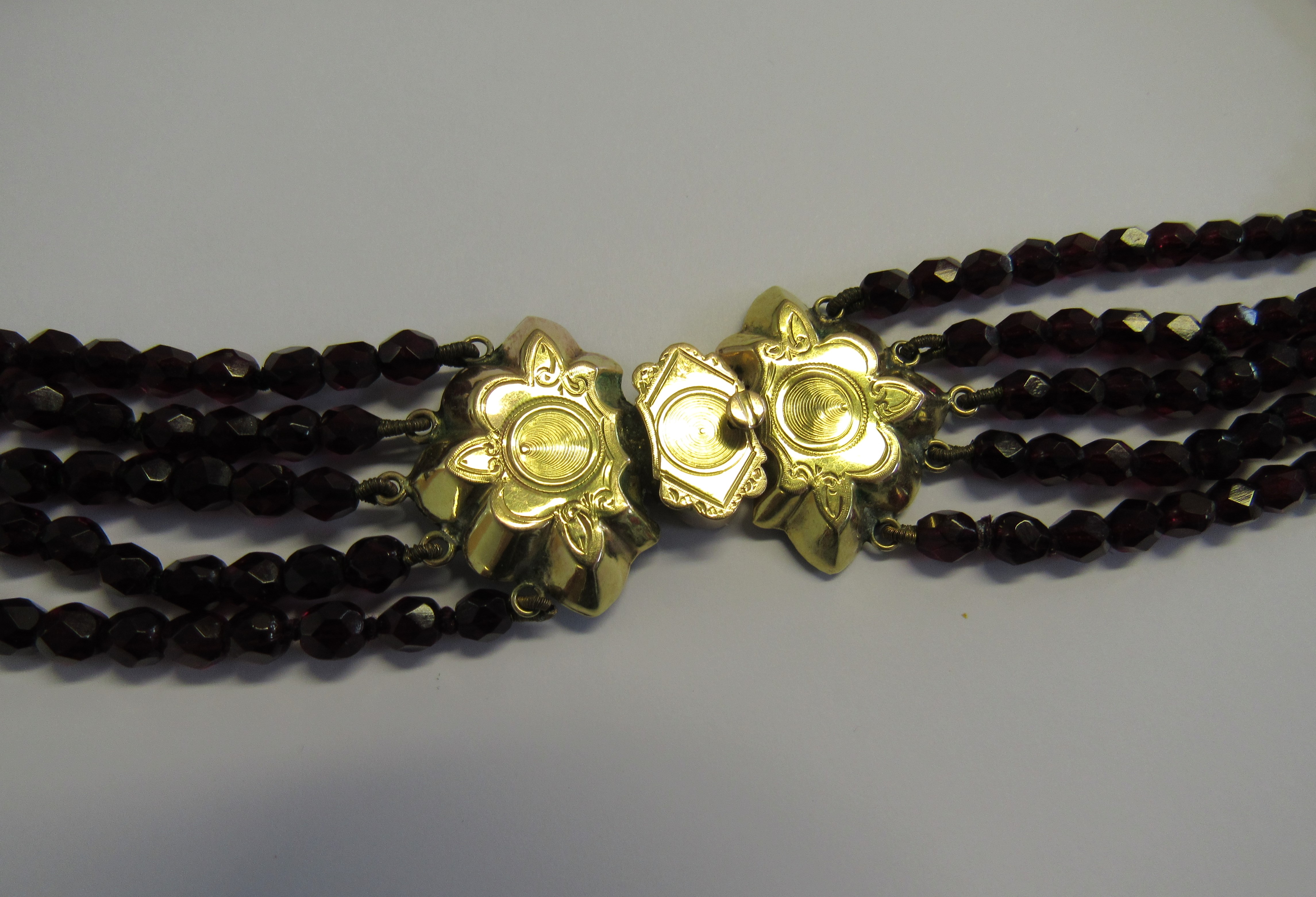 A Victorian Raj garnet choker necklace fitted with a marked 585 bi-coloured gold lotus shaped clasp. - Image 2 of 3