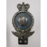 An RAC badge with queens crown, faded blue surround to centre.