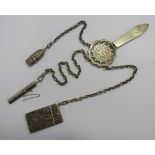 A Victorian large silver Chatelaine with three suspended attachments. The clip hallmarked for London