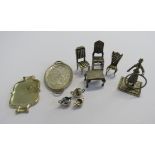 A collection of unmarked white metal micro miniature dolls house items comprising of three dining