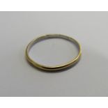 An unmarked gold (tested) narrow band ring with the inside band in unmarked platinum (tested).