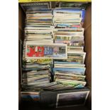 A large box of assorted postcards.