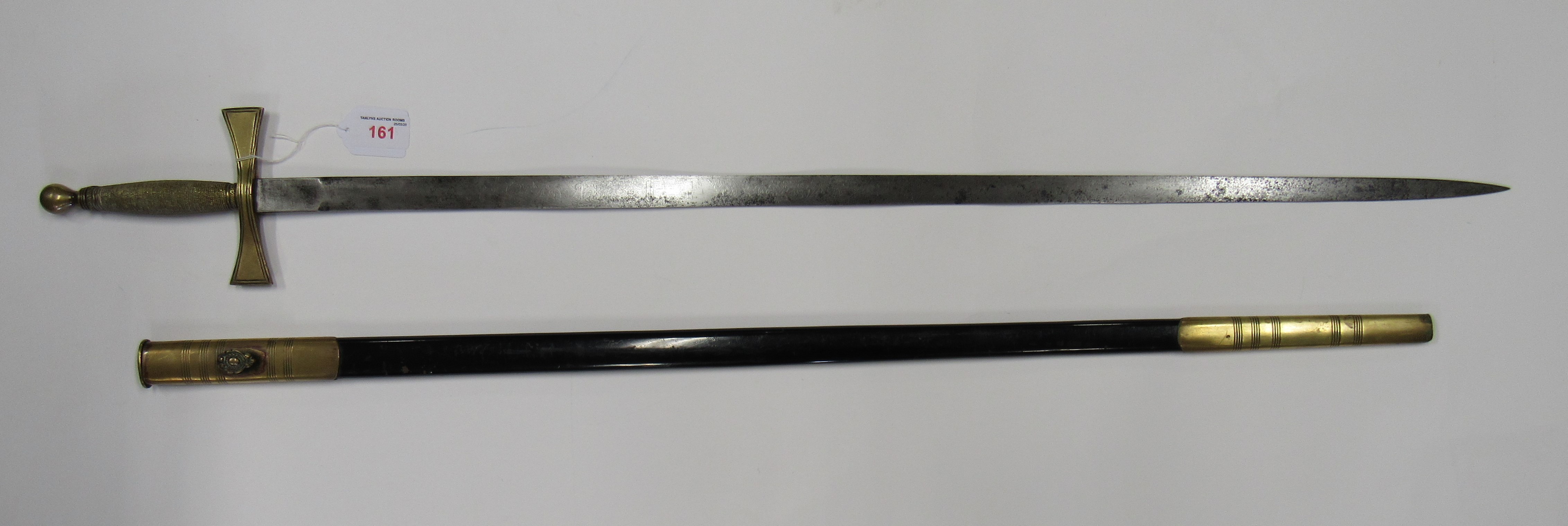 A Masonic sword, the blade length 80cms approx. The blade is in good condition but the etching has