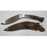 A Kukri with Scabbard blade with chromed finish, some minor rust, scabbard poor.