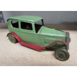 Triang Toys tinplate saloon car No. 541? Painted green and red with lithographed tyres and driver.