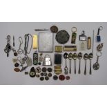 A miscellaneous collection of items to include a cigarette case, lighter key rings and buttons.