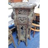LATE 19TH OR EARLY 20TH CENTURY CHINESE HARDWOOD POT STAND WITH PROFUSELY CARVED FLORAL DECORATION