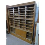 OAK HABERDASHERY CABINET WITH 4 COLUMNS OF DRAWERS OVER 2 PANEL DOORS,