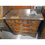 EARLY 19TH CENTURY WALNUT CHEST OF DRAWERS WITH 3 SHORT OVER 3 LONG DRAWERS ON BRACKET SUPPORTS.