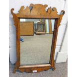 LATE 19TH CENTURY WALNUT FRAMED MIRROR WITH CARVED DECORATION,