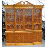 YEW WOOD BOOKCASE WITH 4 ASTRAGAL GLASS DOORS OPENING TO SHELVED INTERIOR OVER 4 PANEL DOORS ON