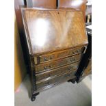 EARLY 20TH CENTURY MAHOGANY DESK WITH FALL FRONT OVER 4 DRAWERS ON SHAPED SUPPORTS