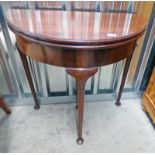MAHOGANY HALF MOON GAMES TABLE WITH TURNOVER TOP ON SHAPED SUPPORTS
