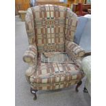 LATE 19TH CENTURY MAHOGANY FRAMED WINGBACK ARMCHAIR ON SHAPED SUPPORTS