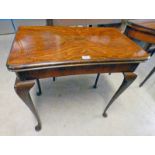 EARLY 20TH CENTURY TURNOVER CARD TABLE ON SHAPED SUPPORTS